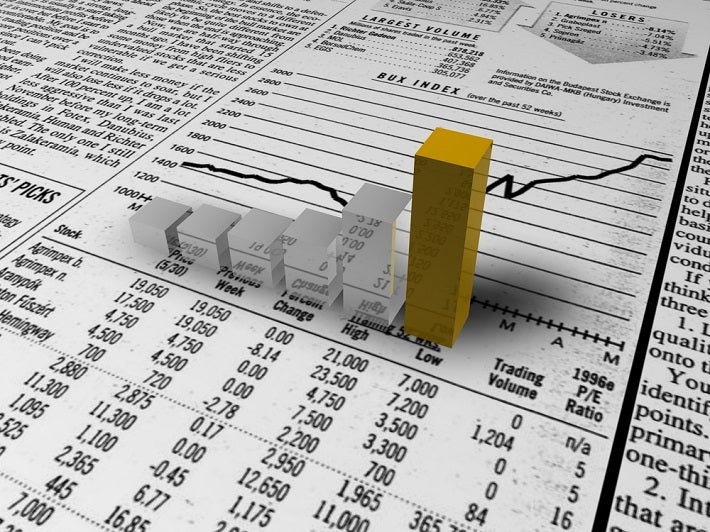 Silver and gold graph bars placed on the figures chart